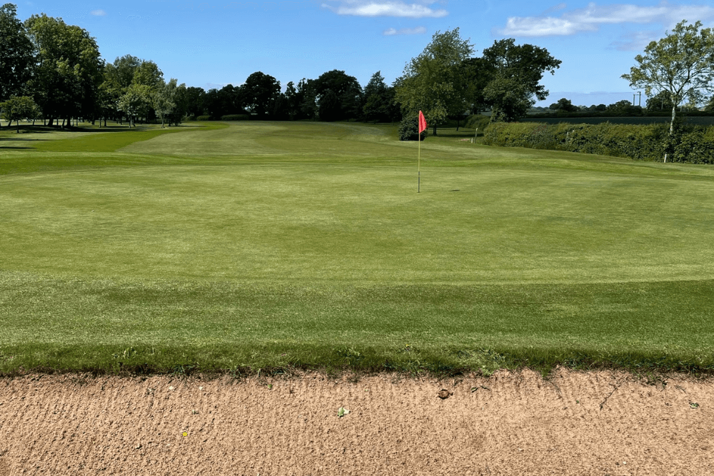 A golf club in Nuneton Warwickshire, showing an image of the green and small amount of the bunker